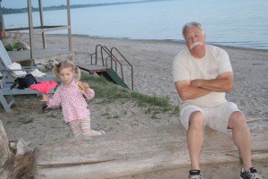 Eating her smore with grandpa.
