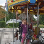 Steve and Lilly on the merry-go-round.